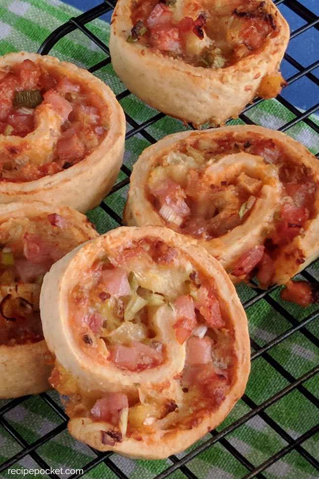 Image showing baked ham and cheese pinwheels, with homemade dough.