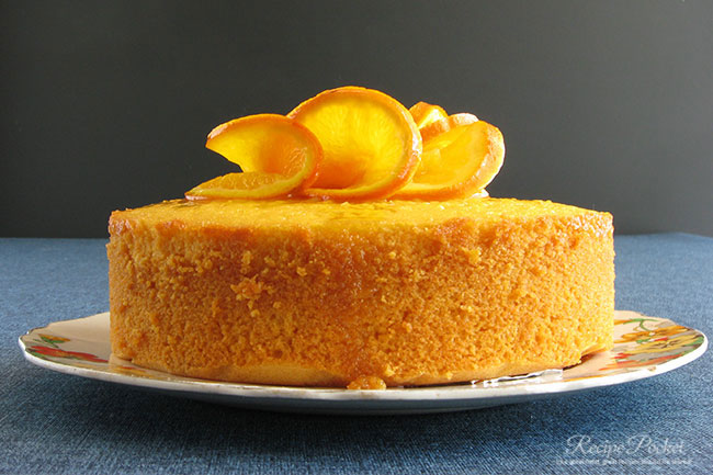 Caramelized orange slices decorate an orange juice cake.