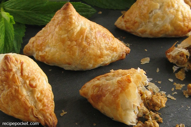 Closeup of chicken puff pastry snacks - easy samosa recipe