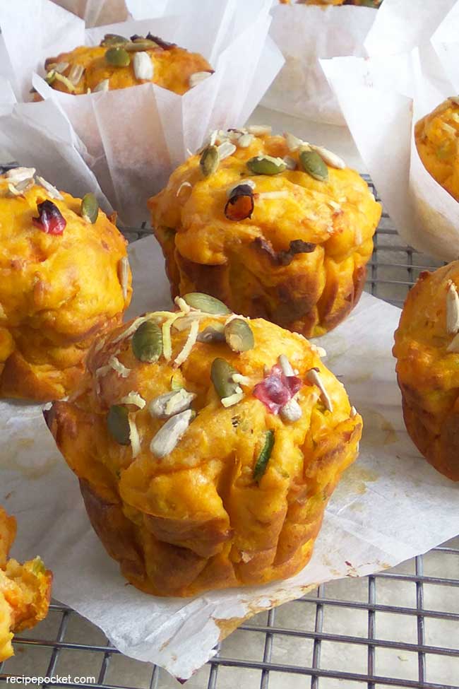 Easy savory sweet potato muffins with pumpkin and sunflower seeds.