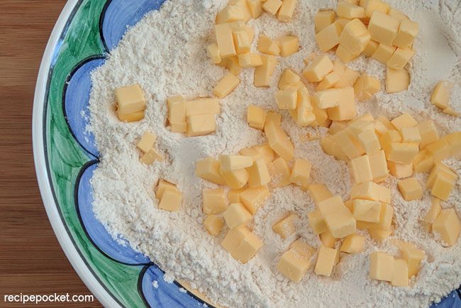 Cubes of chilled butter in flour for shortcrust pastry