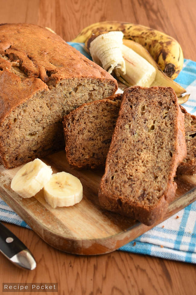Close-up showing slices of easy banana bread on a cutting board.