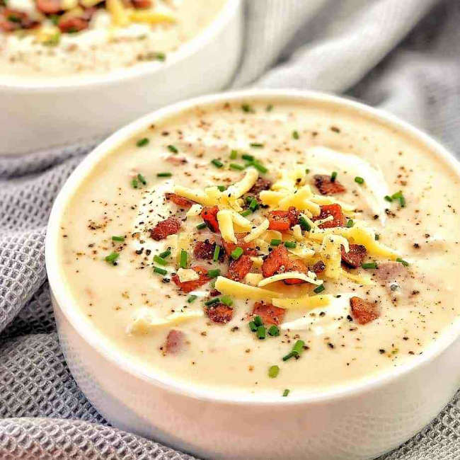 A bowl of cheese and bacon potato soup