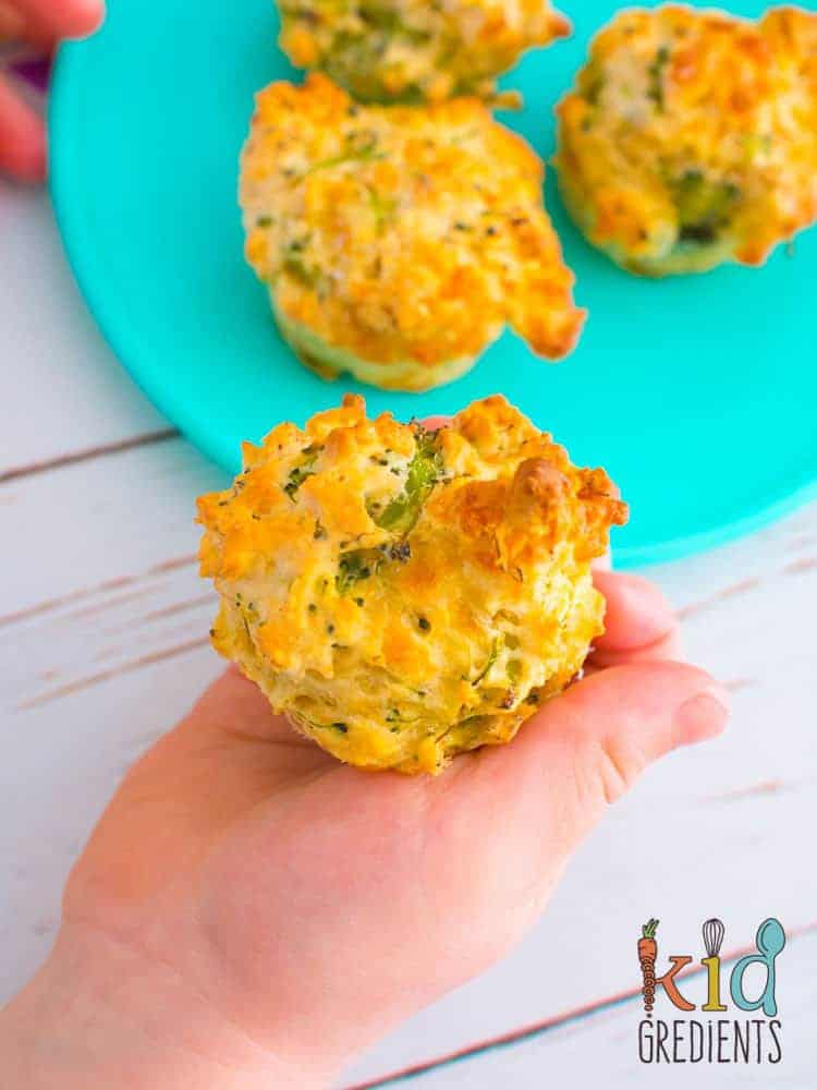 Broccoli and cheese muffins on a blue plate.