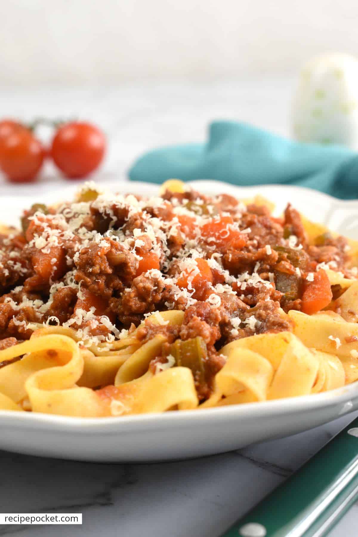 Beef and pork ragu with grated parmesan cheese.