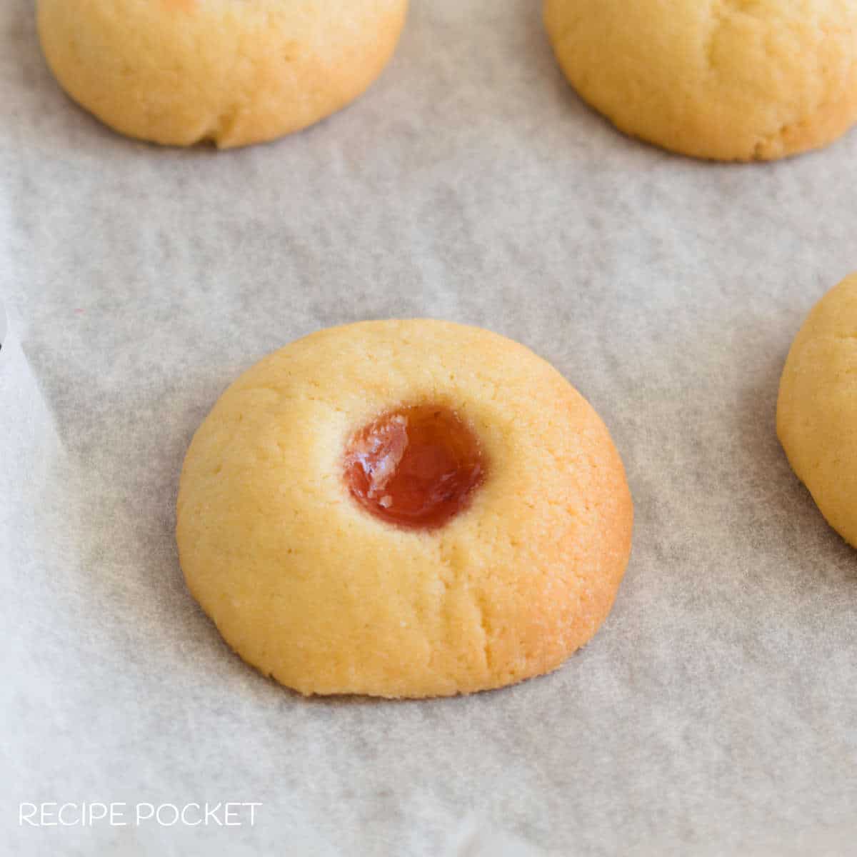 Closeup of a baked jam drop cookie.
