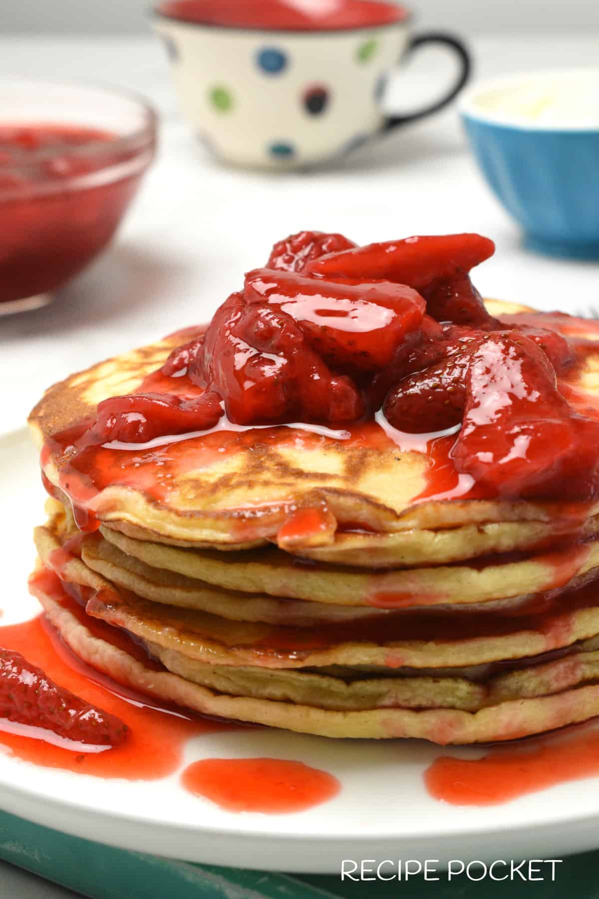 Ricotta pancakes with strawberry compote on top.