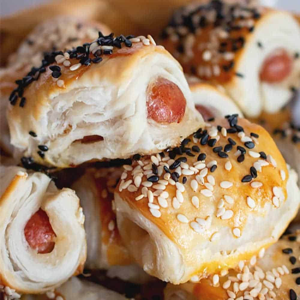 Mini pigs in a blanket made with puff pastry.