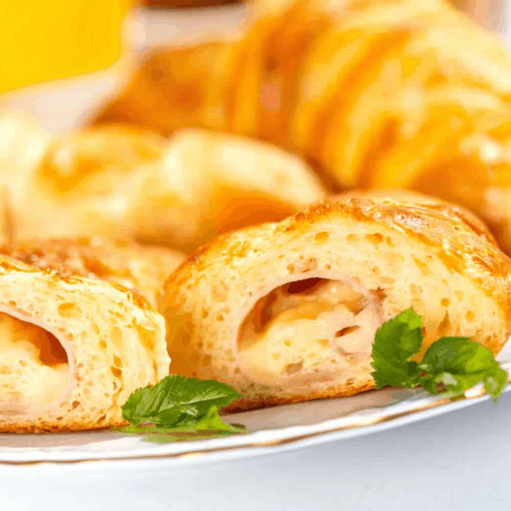 Close up of ham and cheese rolls.