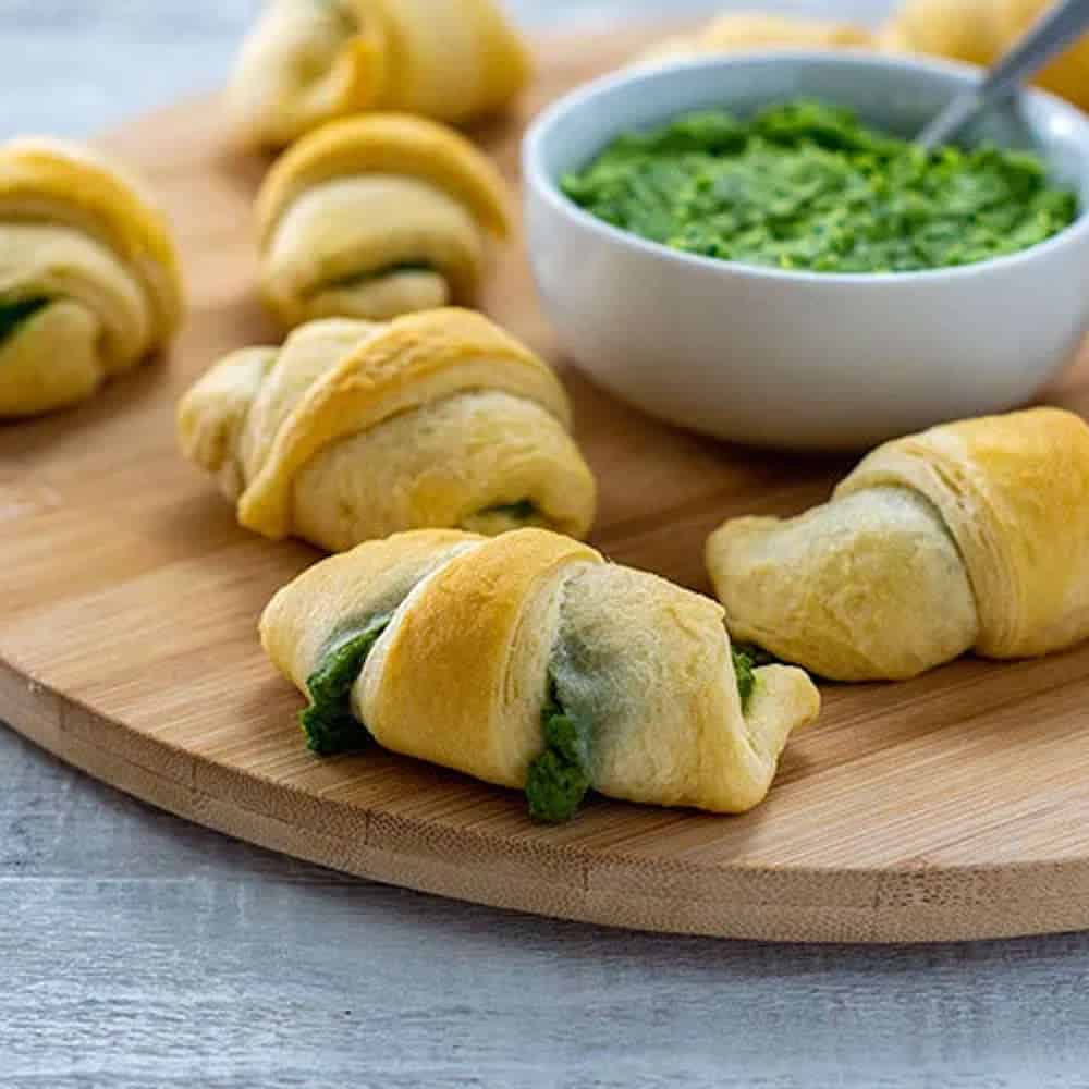 Spinach and artichoke rolls with a spinach dip.
