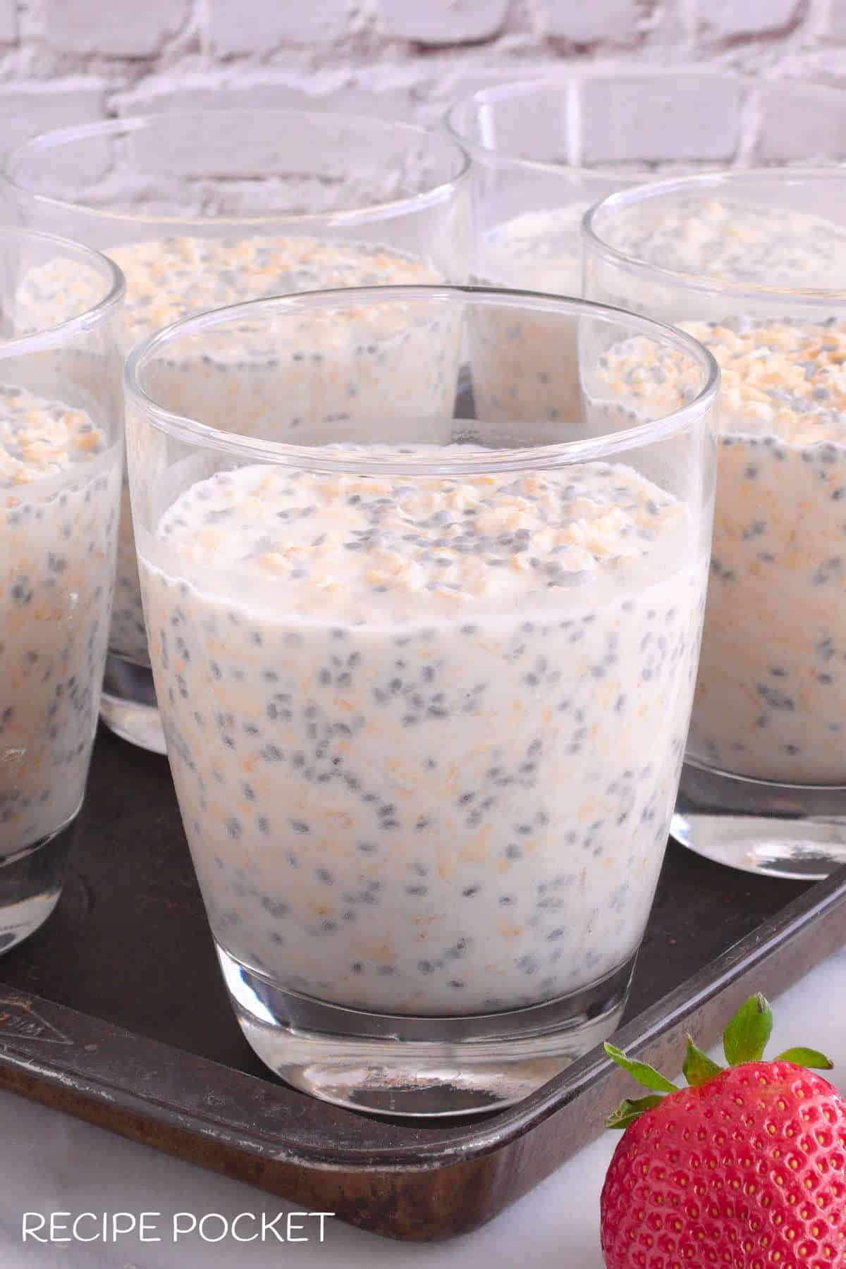 Close up of overnight oats in a glass container.