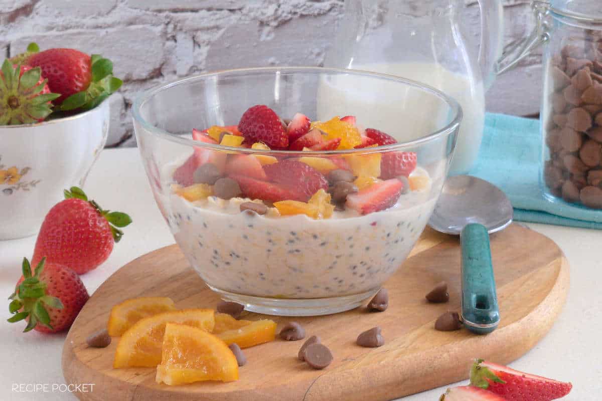 Make easy overnight oats with a strawberry, chocolate chip and orange topping.