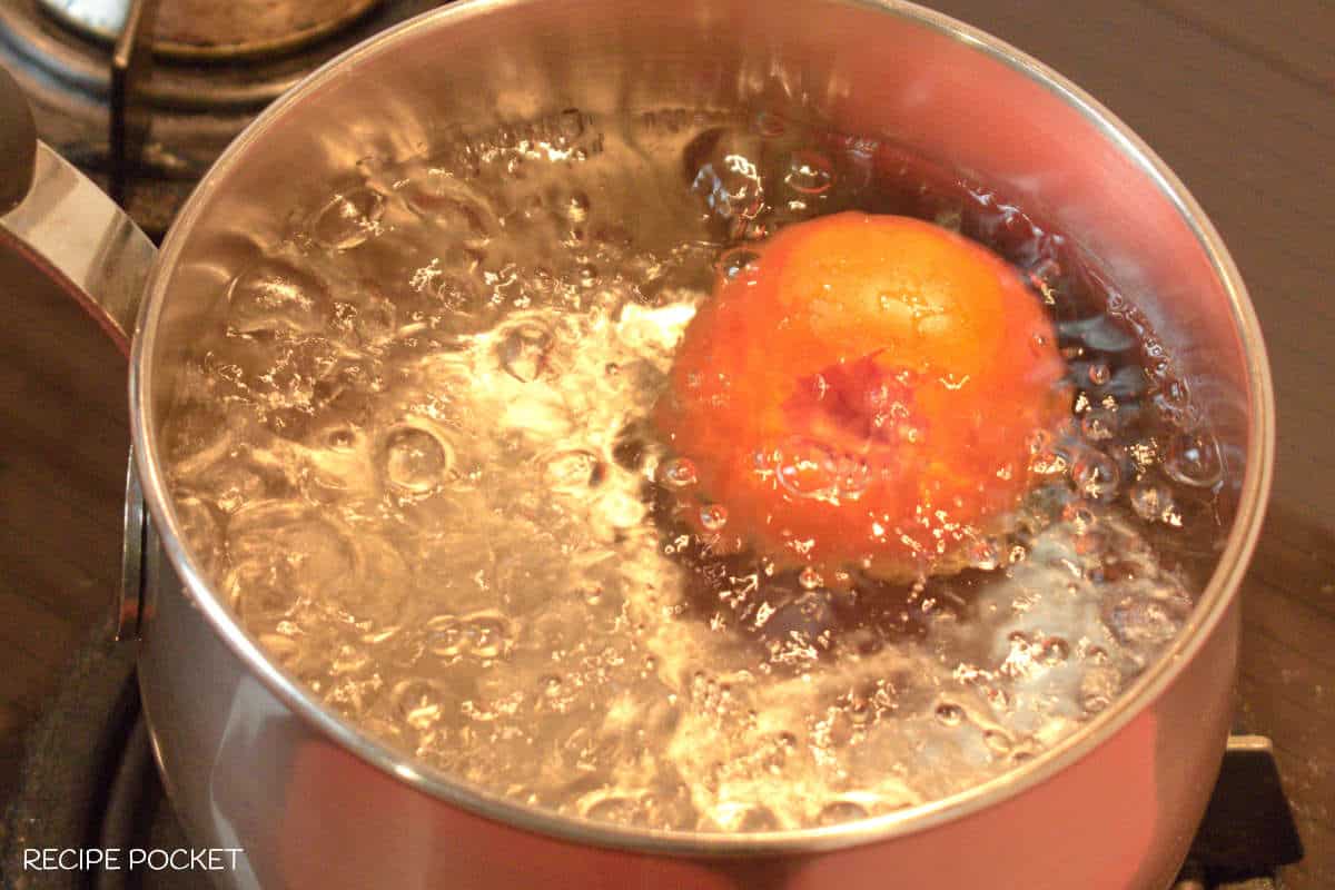 A tomato in boiling water.
