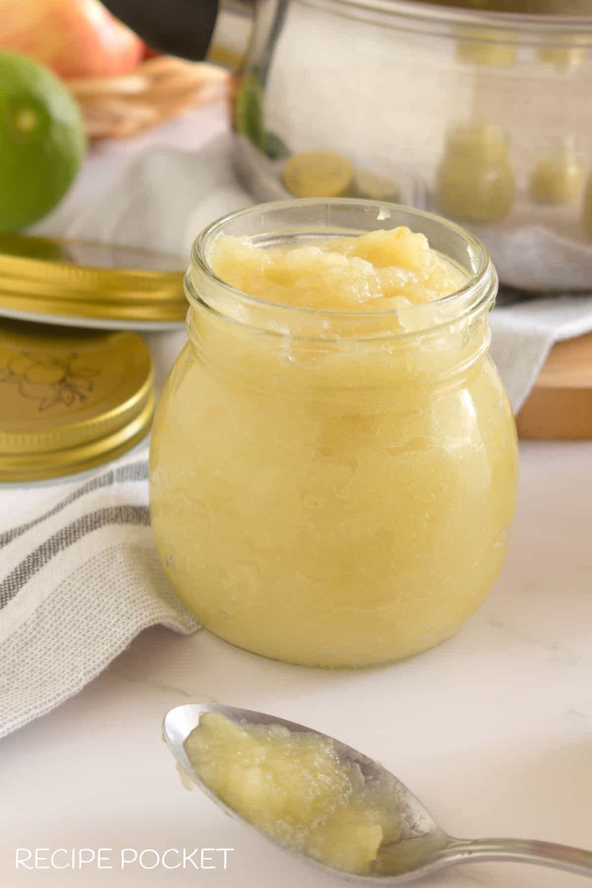 Homemade unsweetened apple sauce in a bottle.