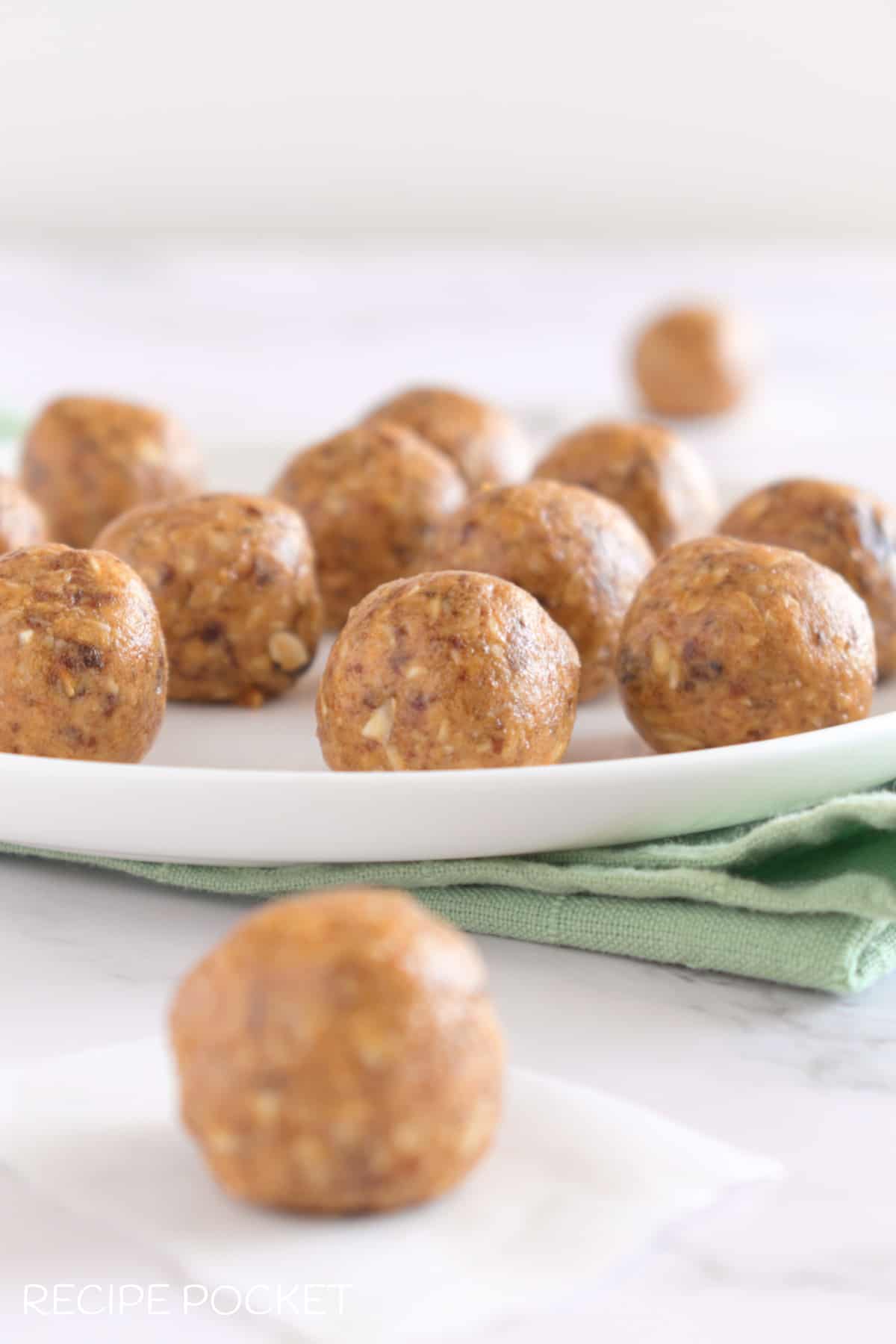 Peanut butter balls with oats on a plate.