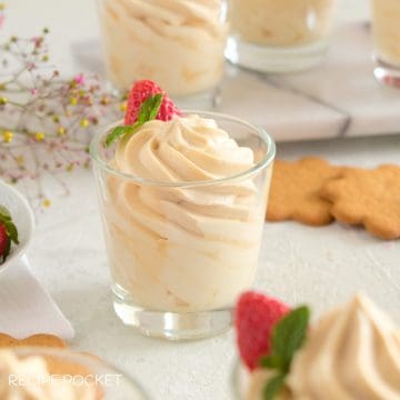 Carmel whipped cream in a dessert glass.