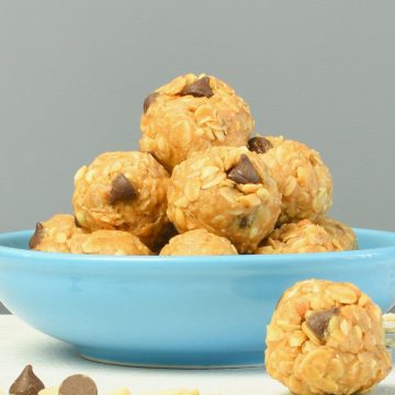 No bake peanut butter oatmeal balls on a blue bowl.